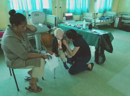 Dr Mia Zhang volunteering for Australian charity, Vision of Islands